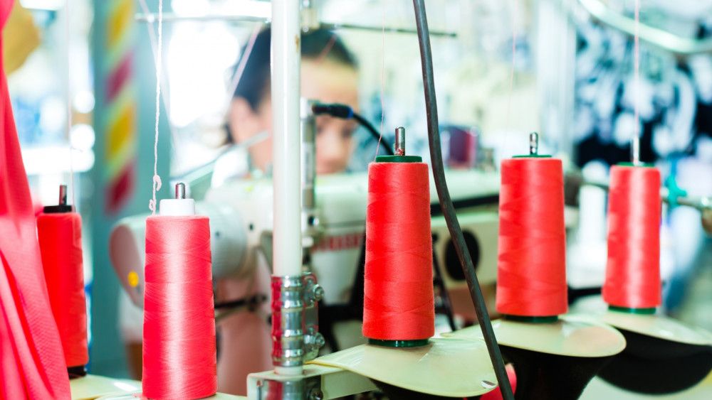 Chinese seamstress working in an SME during rising costs and competitiveness.