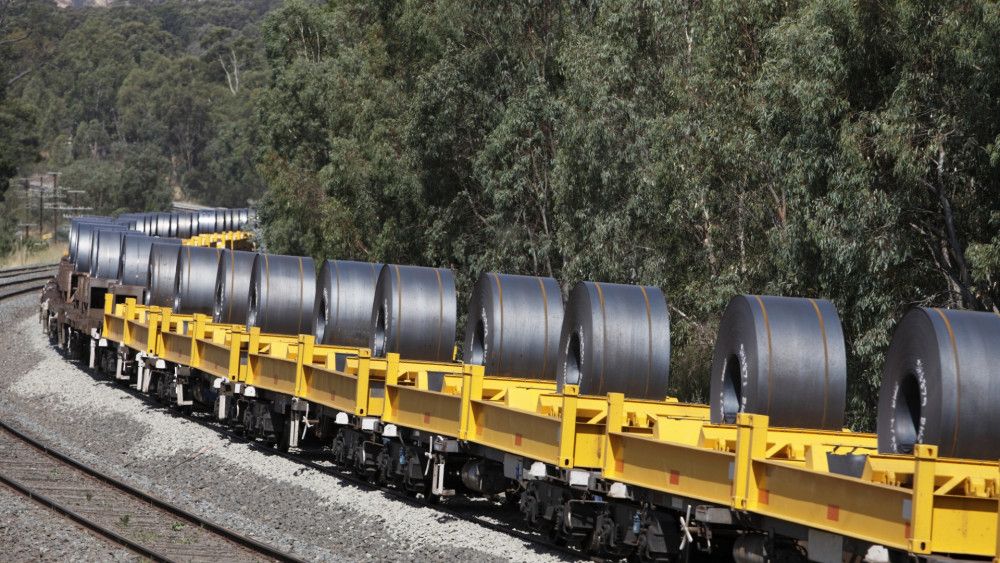 Ready-made steel bobbin transportation via railway by global shipping company. 